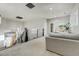 This second story landing features modern railing and lighting, with a view of the front entryway below at 4181 S Ivy Ln, Cherry Hills Village, CO 80111