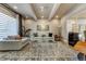 Bright and airy living room with large windows, comfortable seating, and stylish decor at 4181 S Ivy Ln, Cherry Hills Village, CO 80111