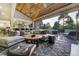 Spacious living room boasts vaulted wood ceiling, plush seating, and seamless indoor-outdoor flow at 4181 S Ivy Ln, Cherry Hills Village, CO 80111