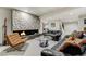 The living room has a fireplace with modern tile and nice leather seating at 4181 S Ivy Ln, Cherry Hills Village, CO 80111