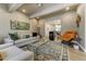 Stylish living room with comfortable seating, modern artwork, and hardwood floors at 4181 S Ivy Ln, Cherry Hills Village, CO 80111