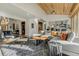 Open living area with vaulted wood ceilings and a seamless connection to the kitchen at 4181 S Ivy Ln, Cherry Hills Village, CO 80111