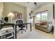 Well appointed office includes a comfortable couch, desk, and natural light at 4181 S Ivy Ln, Cherry Hills Village, CO 80111