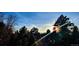 A sky view of the forest, showcasing mature trees with vibrant green foliage against a clear blue sky at 4181 S Ivy Ln, Cherry Hills Village, CO 80111