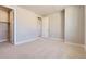 Spacious bedroom with neutral carpeting, closet, and doorway providing ample space and storage at 4769 Weitbrec Ln, Castle Rock, CO 80104