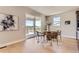 Bright dining area features a round table with seating for four and a sliding glass door to the outside deck at 4769 Weitbrec Ln, Castle Rock, CO 80104