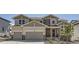 Charming two-story home featuring a two-car garage and stone accents on the facade, nestled in a well-maintained community at 4769 Weitbrec Ln, Castle Rock, CO 80104