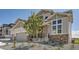 Attractive two-story home showcasing a well-manicured front yard, complemented by stone details and a welcoming entrance at 4769 Weitbrec Ln, Castle Rock, CO 80104