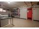 Functional basement space with washer, dryer, bike storage, and access door at 1436 N Gilpin St # 2, Denver, CO 80218