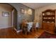 Inviting dining area with vintage decor and hardwood floors with access to the kitchen at 1436 N Gilpin St # 2, Denver, CO 80218