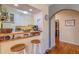 Charming kitchen with bar seating and a view into the adjacent dining area at 1436 N Gilpin St # 2, Denver, CO 80218