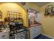 Charming kitchen with stainless steel range, ample cabinet space, and arched doorway at 1436 N Gilpin St # 2, Denver, CO 80218