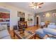 Inviting living room with an open layout, connecting the dining area and bedroom beyond at 1436 N Gilpin St # 2, Denver, CO 80218