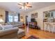 Open living space with hardwood floors and a view of the kitchen and breakfast bar at 1436 N Gilpin St # 2, Denver, CO 80218