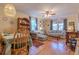 Open-concept living and dining area featuring hardwood floors and vintage decor throughout at 1436 N Gilpin St # 2, Denver, CO 80218