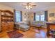 Bright living room features hardwood floors and is decorated with vintage decor at 1436 N Gilpin St # 2, Denver, CO 80218