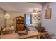 Cozy living room with dining table, hutch, and comfortable armchair near a bright window at 1436 N Gilpin St # 2, Denver, CO 80218