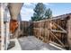 Cozy backyard enclosed by a wooden fence, offering privacy and a small concrete patio at 1482 S Pierson St # 75, Lakewood, CO 80232