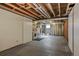 Unfinished basement space featuring an exposed ceiling, laundry appliances and a small window for natural light at 1482 S Pierson St # 75, Lakewood, CO 80232