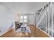 Bright living room with hardwood floors, large window, and a cozy seating area at 1482 S Pierson St # 75, Lakewood, CO 80232