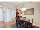 Comfortable dining room area leading to kitchen and natural light at 7865 Vallagio Ln # 207, Englewood, CO 80112