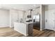Modern kitchen with a center island, stainless steel appliances, and ample counter space at 9454 Yampa St, Commerce City, CO 80022