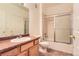 Well-maintained bathroom featuring a shower over tub, single vanity, and tiled floors, offering essential comfort and functionality at 8481 W Union Ave # 2-103, Littleton, CO 80123