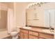 Functional bathroom featuring a dual sink vanity, tiled shower and tub, providing comfort and convenience at 8481 W Union Ave # 2-103, Littleton, CO 80123