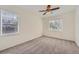 Inviting bedroom with plush carpet and abundant natural light from two windows, creating a serene and comfortable retreat at 8481 W Union Ave # 2-103, Littleton, CO 80123