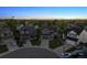 Aerial view of homes in a suburban neighborhood with mature trees at 12277 Krameria St, Brighton, CO 80602