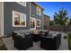Back patio with outdoor seating and fire pit at 12277 Krameria St, Brighton, CO 80602