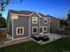 Backyard view with outdoor seating, grassy area, and well-maintained exterior at 12277 Krameria St, Brighton, CO 80602