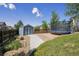 A fenced yard features a shed and trampoline set on neutral stones at 12277 Krameria St, Brighton, CO 80602