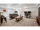 Finished basement with a seating area, desk, and a modern design at 12277 Krameria St, Brighton, CO 80602