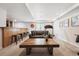 Finished basement featuring a wet bar, a seating area, and home gym equipment at 12277 Krameria St, Brighton, CO 80602