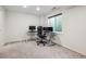 A carpeted bedroom is staged as an office with natural light from the window at 12277 Krameria St, Brighton, CO 80602