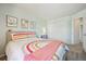 Bright bedroom featuring a comfortable bed and closet at 12277 Krameria St, Brighton, CO 80602