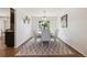 Charming dining room with a round table, comfortable seating, and natural light at 12277 Krameria St, Brighton, CO 80602