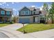 Charming two-story home with an attached two-car garage, well-kept lawn, and traditional curb appeal at 12277 Krameria St, Brighton, CO 80602