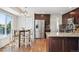 Bright kitchen with stainless steel refrigerator and hardwood floors at 12277 Krameria St, Brighton, CO 80602