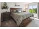 Bedroom features a large bed, dresser, and a window offering natural light and a view at 12277 Krameria St, Brighton, CO 80602