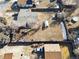 An aerial view of a property with a large yard and neighboring houses at 8280 E 104Th Way, Henderson, CO 80640