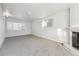 Bright basement with a fireplace, carpeted floors, and neutral paint tones at 8280 E 104Th Way, Henderson, CO 80640