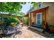 Charming backyard with a brick patio, dining set, and lush landscaping at 807 9Th St, Golden, CO 80401