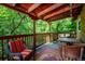 Inviting balcony featuring outdoor seating, a vintage rug, and lush, green views at 807 9Th St, Golden, CO 80401