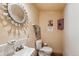 Cozy bathroom featuring a vintage sink, white tile, and unique mirror, creating a charming and functional space at 807 9Th St, Golden, CO 80401