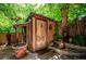 Charming exterior featuring a rustic wooden door, lush greenery, and unique architectural details at 807 9Th St, Golden, CO 80401