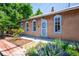 Quaint exterior with light blue trim, flower beds, and a charming facade at 807 9Th St, Golden, CO 80401