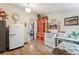 Charming kitchen featuring vintage refrigerator and colorful red-and-yellow cabinetry at 807 9Th St, Golden, CO 80401