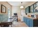 Laundry room with modern washer and dryer, ample counter space, and built-in cabinets for convenient storage at 807 9Th St, Golden, CO 80401